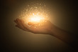 © Laura Сrazy - magic particles on the palms of a woman, a stream of magical energy emanating from female hands