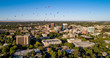 Aerial view of Boise Idaho with many hot air balloons floating above