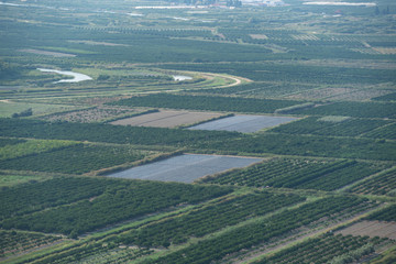 Aufkleber - Top view of agricultural land. Valley of fields and fruit farms with irrigation system