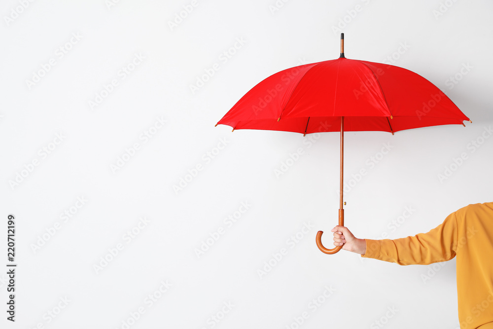 Person holding open umbrella on white background with space for design - obrazy, fototapety, plakaty 