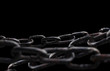 Rusty chain isolated on black background.