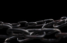 Rusty Chain Isolated On Black Background.