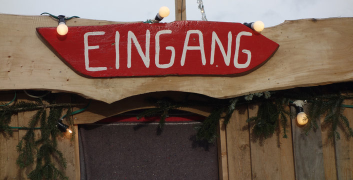 A banner written in german meaning entry at the top of a door