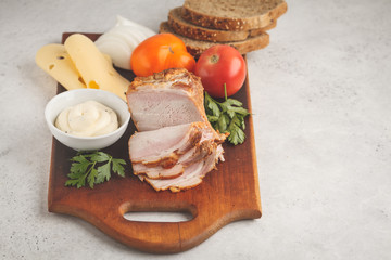 Wall Mural - Ingredients for ham and cheese sandwiches on a wooden board, white background.