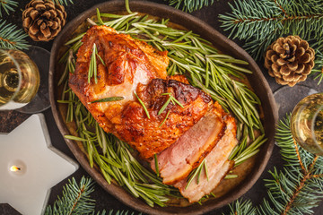 Wall Mural - Baked Christmas ham with rosemary. Christmas background, top view.