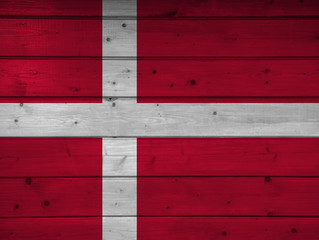 Wall Mural - Flag of Denmark on wooden background, surface. Wooden wall, planks. National flag.