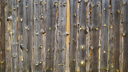 wooden fence of boards with beautiful structure in the village around the house