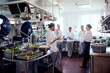 © Maskot - Team of chefs meeting in kitchen