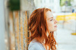 © contrastwerkstatt - Thoughtful young woman with tousled red hair