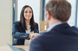 © contrastwerkstatt - Smiling businesswoman shaking hands