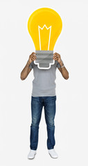 Canvas Print - Man holding a light bulb icon