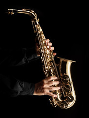 Wall Mural -  Musician playing alt saxophone on black