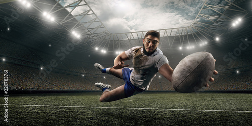 Obrazy Rugby  brudny-gracz-rugby-lapie-pilke-w-locie-na-profesjonalnym-stadionie-rugby