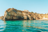 Fototapeta Do akwarium - Rocks, Cliffs And Ocean Landscape At Lagos Bay Coast In Algarve, Portugal