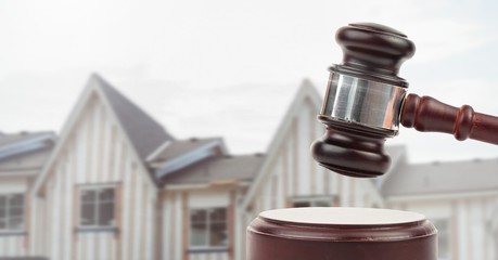 Poster - Gavel and houses on building construction site auction
