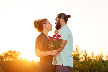 Adult couple in love on sunset background. Man and woman are happy together. 45 years - second youth.