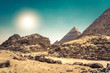 Egyptian pyramids in sand desert and clear sky..