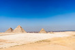 Egypt. Cairo - Giza. General view of pyramids from the Giza Plateau (from left: the Pyramid of Chufu /Cheops/, Khafre, Menkaure /Mykerinos/ and one of the small pyramids known as Queens' Pyramids)