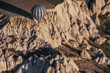 Goreme, Cappadocia, Turkey .   Top view of colorful hot air balloons flying over the Love valley on sunrise.