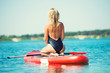 © Denis - Young sexy woman swimming on paddle board.Water sports , active lifestyle.