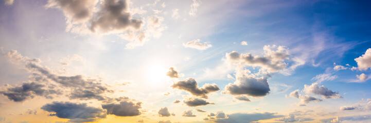Wall Mural - Colorful sky with with sun and clouds as background