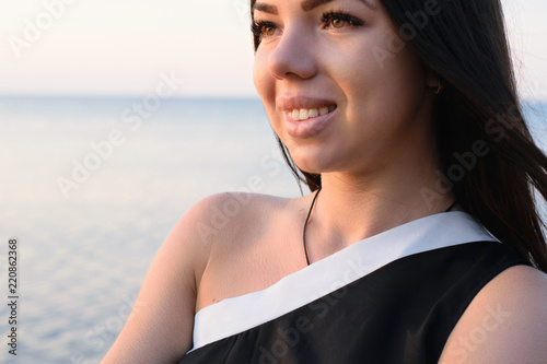 Fotografie, Obraz close portrait of an attractive girl with beautiful lips and dimples on her chee