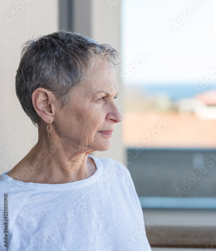Profile Of Beautiful Older Woman With Short Grey Hair And White