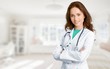 © BillionPhotos.com - Young female doctor with stethoscope on blurred hospital