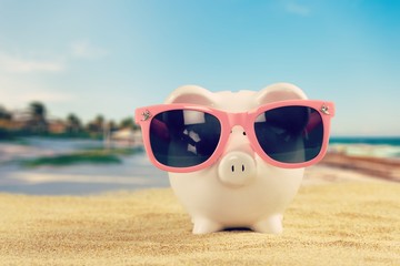 Sticker - Summer piggy bank with sunglasses on the beach