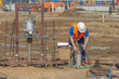 Worker conducts environmental testing of soil at the construction site