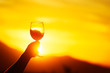 Wine glass at sunset with sun inside