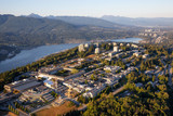 Aerial view of Burnaby Mountain during a vibrant sunny summer sunset. Taken in Vancouver, BC, Canada.