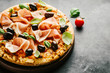 © nerudol - Traditional italian pizza on dark table
