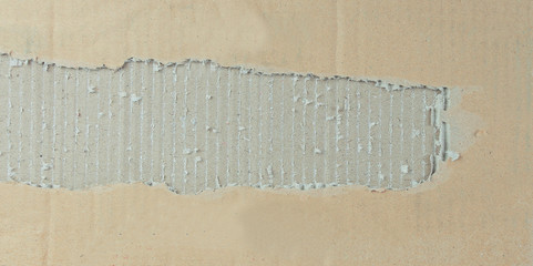 two torn piece of cardboard on white background