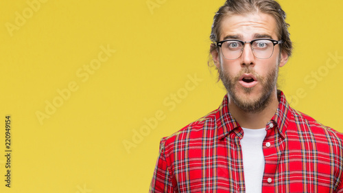 Young Handsome Man With Long Hair Wearing Glasses Over Isolated