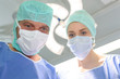 Male and female medical workers wearing masks