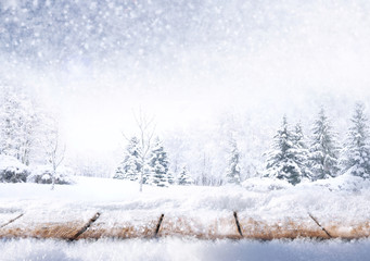 Poster - Winter christmas scenic background with copy space. Wooden flooring strewn with snow in forest and landscape with fir-trees covered with snow on nature.