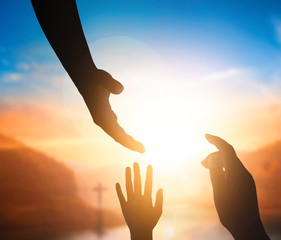 Wall Mural - world peace day concept:silhouette of jesus reaching out hand