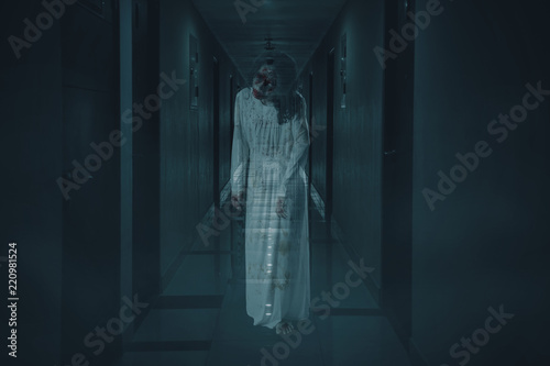 Scary female ghost walks in the hotel corridor Tableau sur Toile