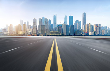 The expressway and the modern city skyline are in Chongqing, China.