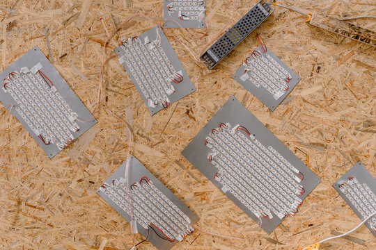 Top view of laptop keyboard for making mosaic on wooden table