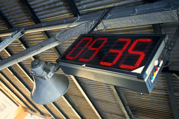electronic clock with red dial