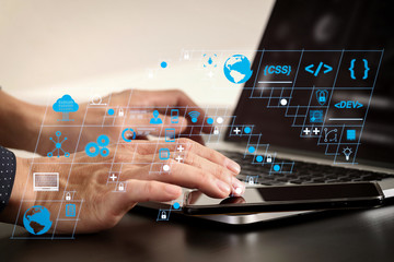 Poster - close up of businessman hand working with smart phone and laptop and digital tablet computer in modern office