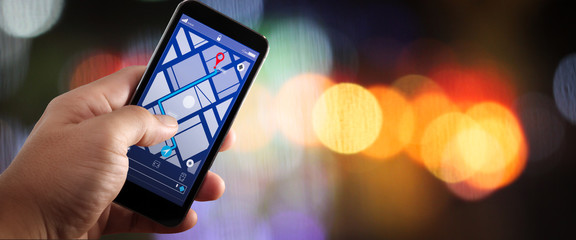Poster - Close up of Tourist using GPS map navigation on smartphone application screen for direction to destination address in the city with travel and technology concept.