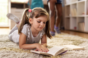 Wall Mural - Schoolgirl reading a book