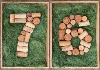 Wall Mural - Number 76 seventy six  made of wine corks on green background in wooden box