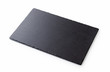 a rectangular piece of slate stone on a white background