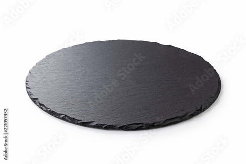 Fotomural Black round stone plate with white background