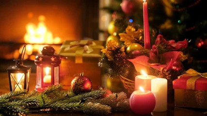 Wall Mural - 4k background with burning firepalce, Christmas tree and candles at New Years eve