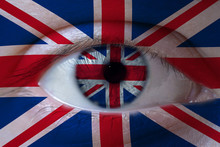 Human Face Painted With Flag Of United Kingdom On The Face And The Iris. The Concept Of The British View Of Life.